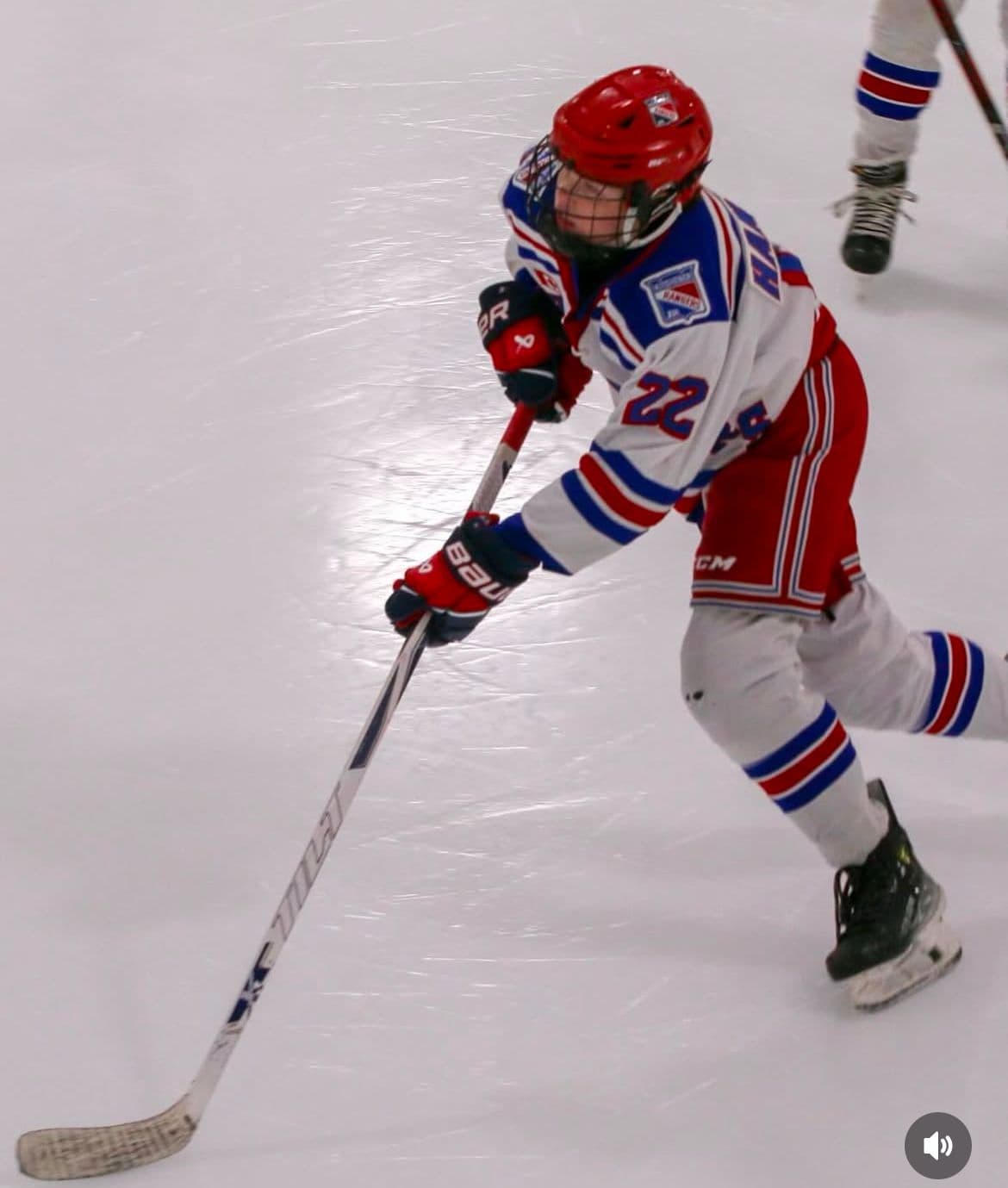 Player taking a powerful shot with a Tilt hockey stick
