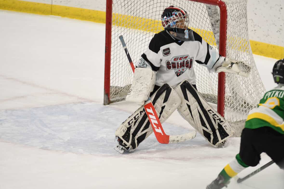 Goalie in net ready to make a save with Tilt goalie stick