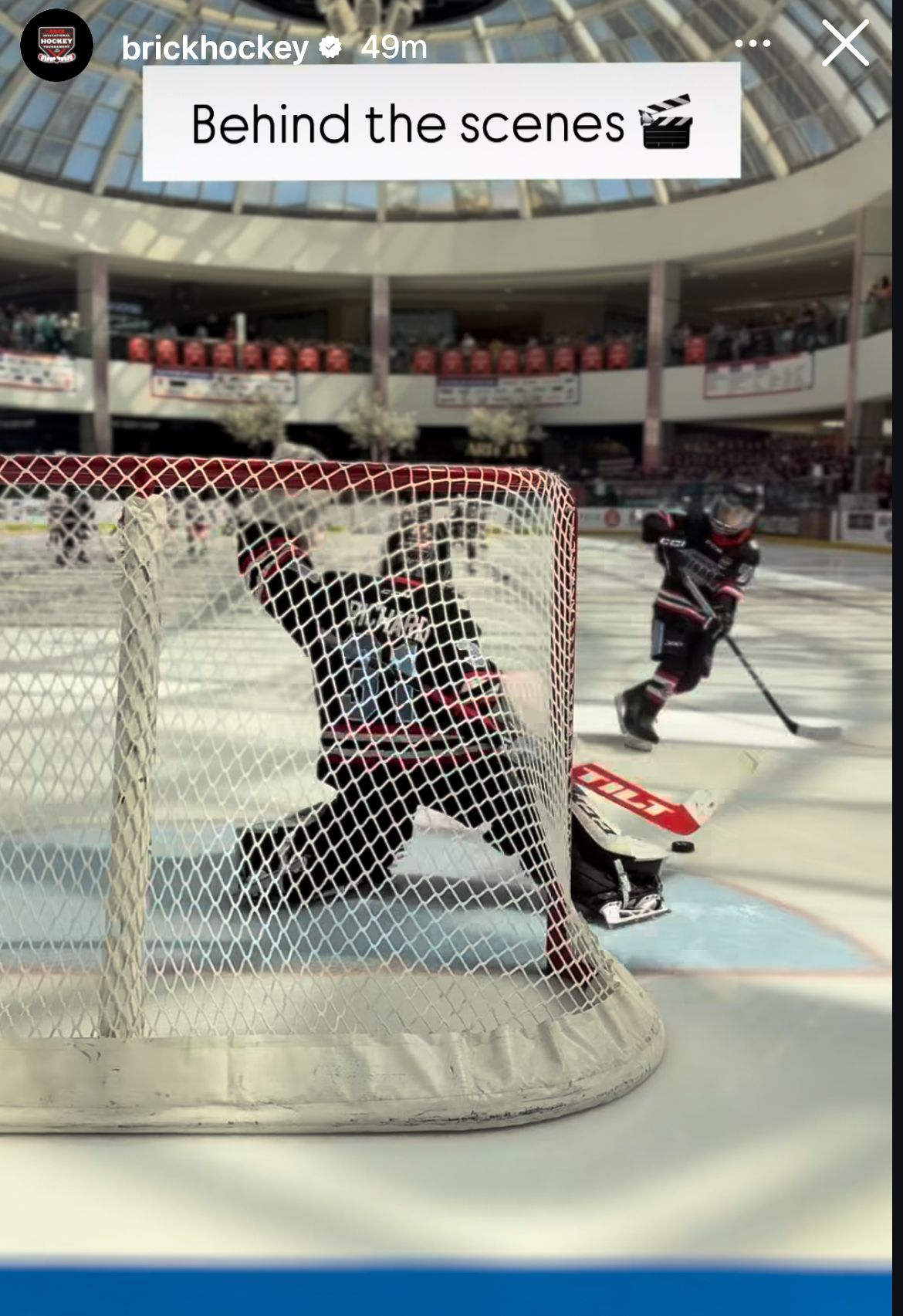 Team photo with goalie in green and red jerseys