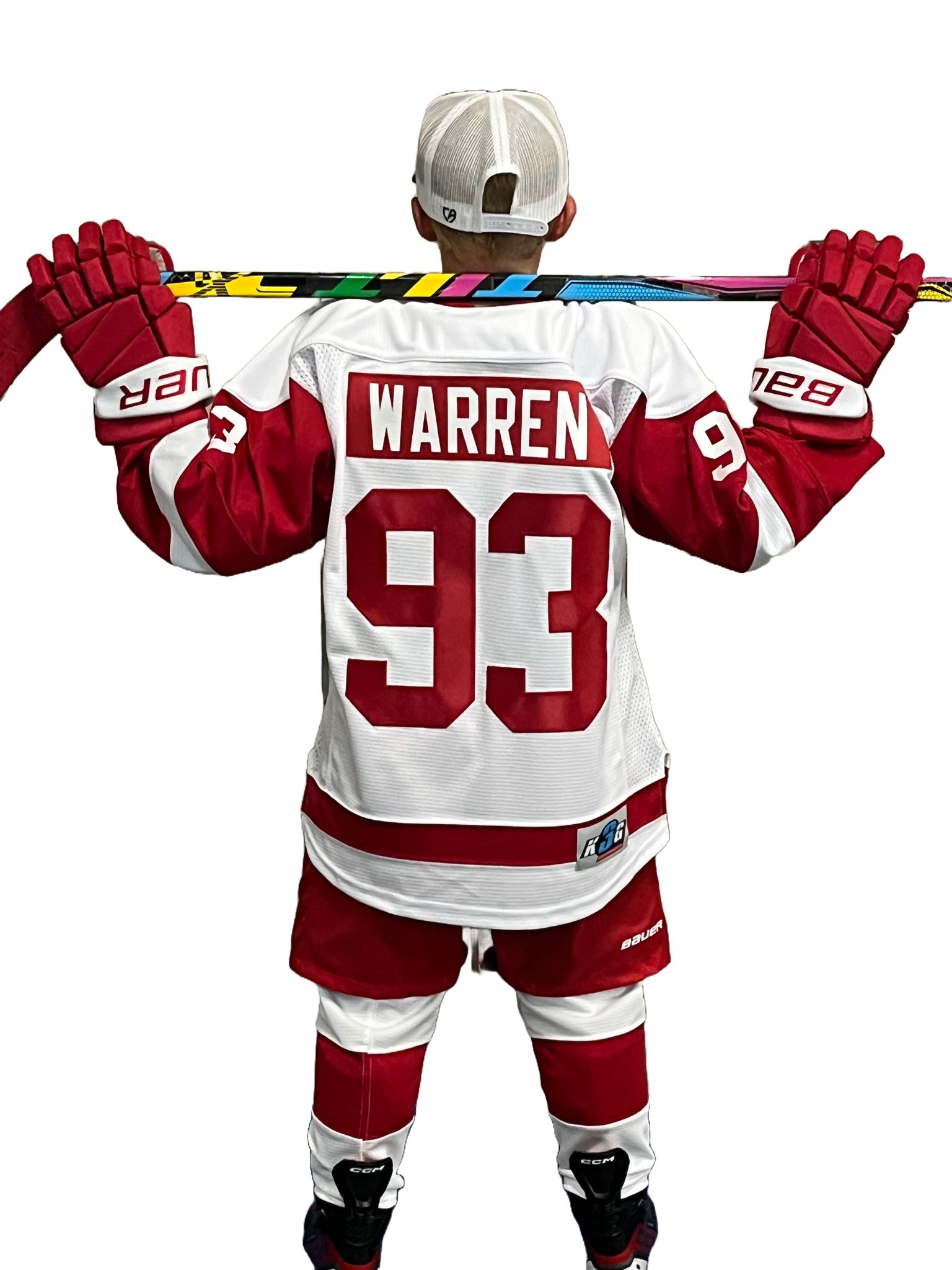 Youth player mid-stride with colorful Tilt stick